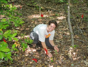 Photo of Melissa McCormick working in the field.